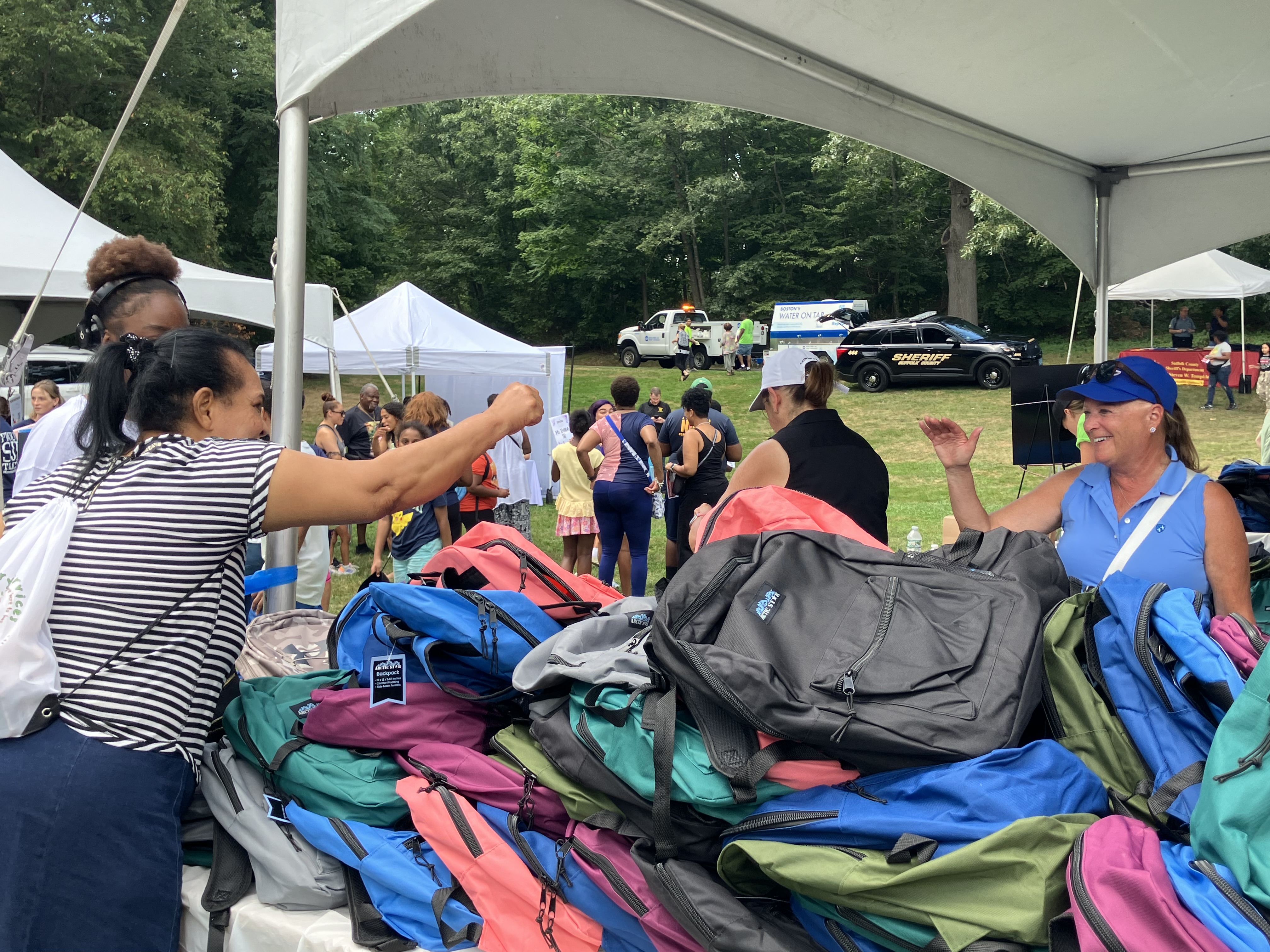 Kathy Griffin with families at the Backpack Giveaway.