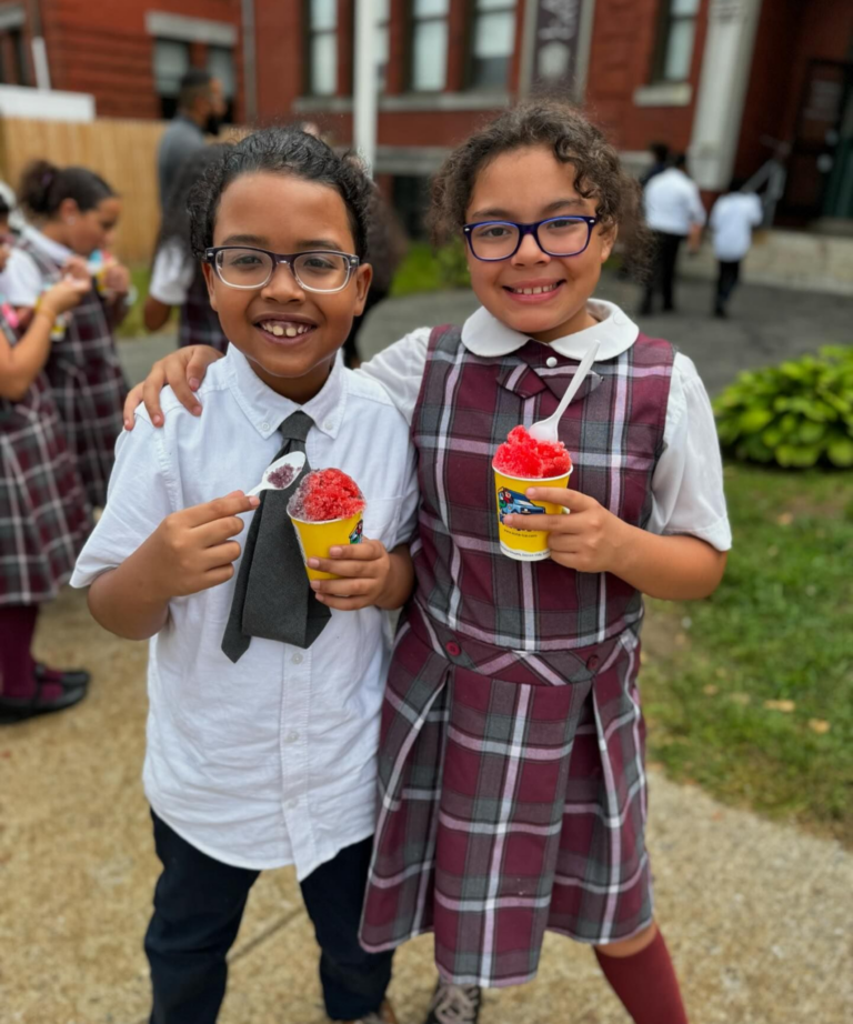 Lawrence Catholic Academy students eating slushies