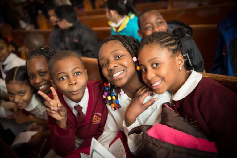 Students smiling in uniform