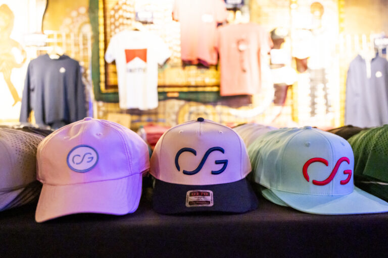 Hats at the CoreyFest merch table