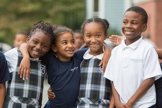 Four students in school uniforms