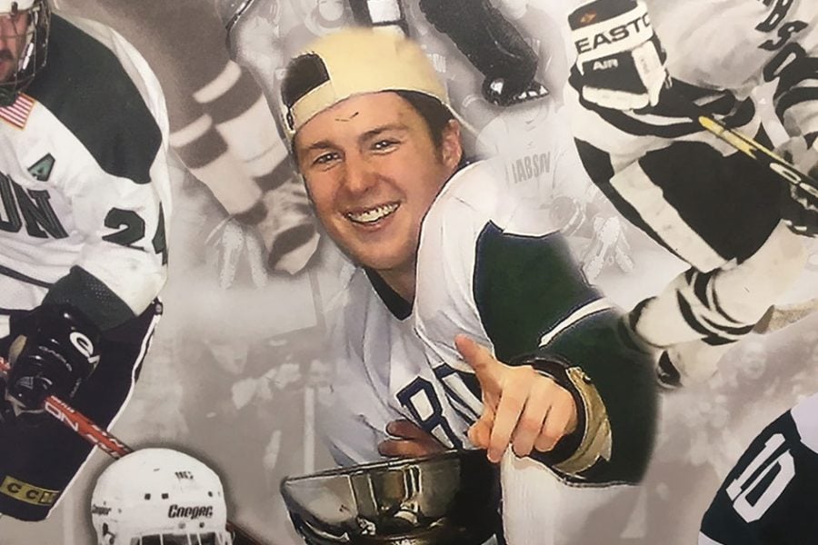 The legacy of the late Corey Griffin ’10, pictured here in a mural from the ice hockey team locker room named in his honor, remains a big part of the Babson community.