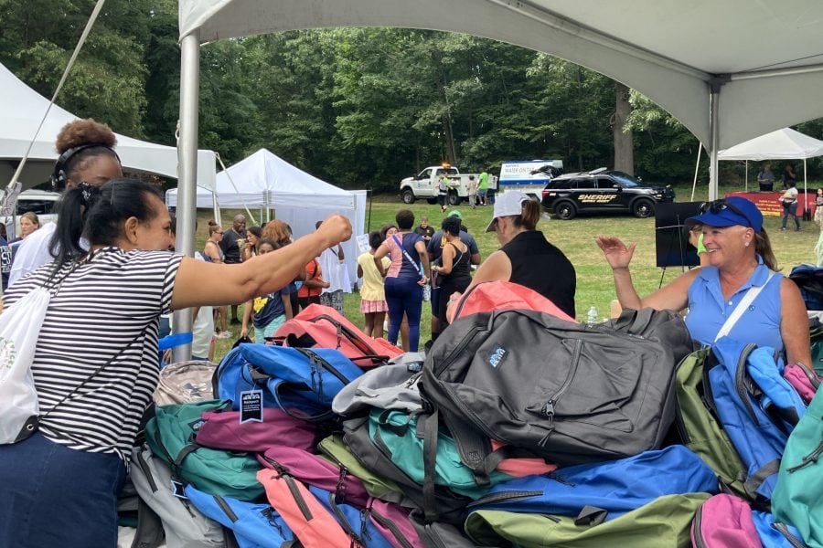 Kathy Griffin with families at the Backpack Giveaway.