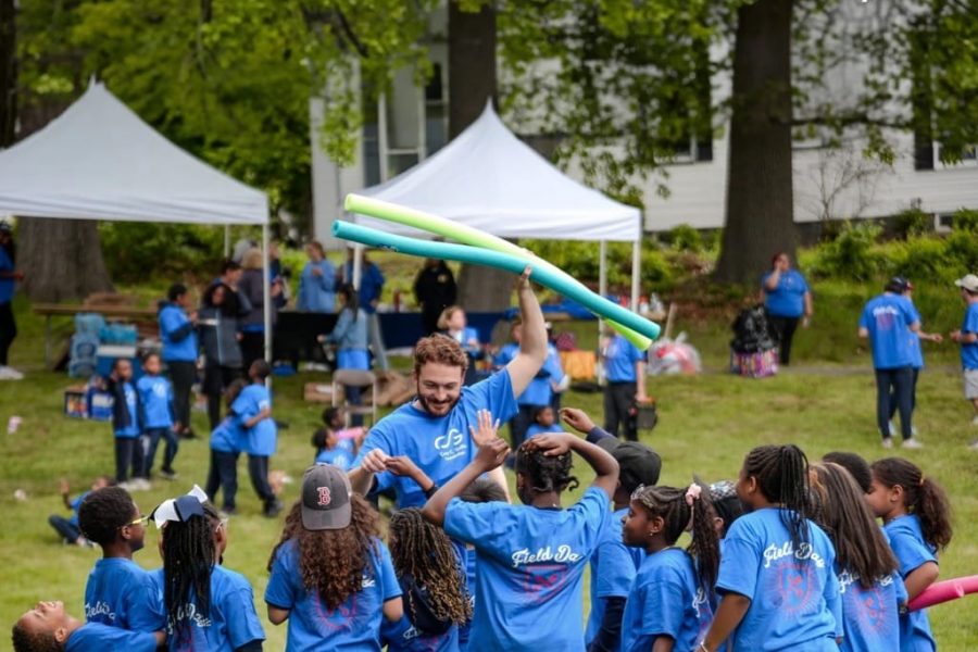 Man and children playing field games